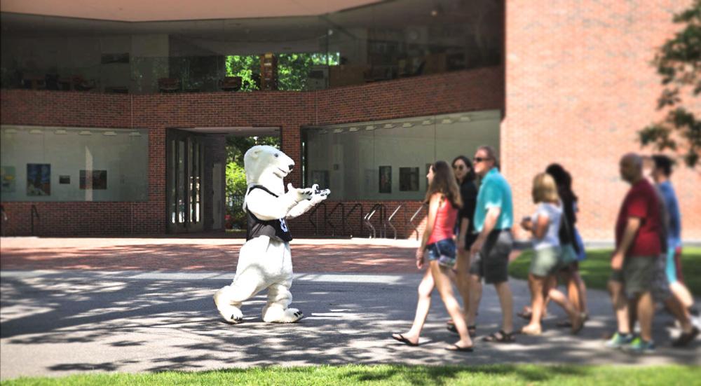 The Bowdoin Polar Bear leads a tour past the Visual Arts Center.